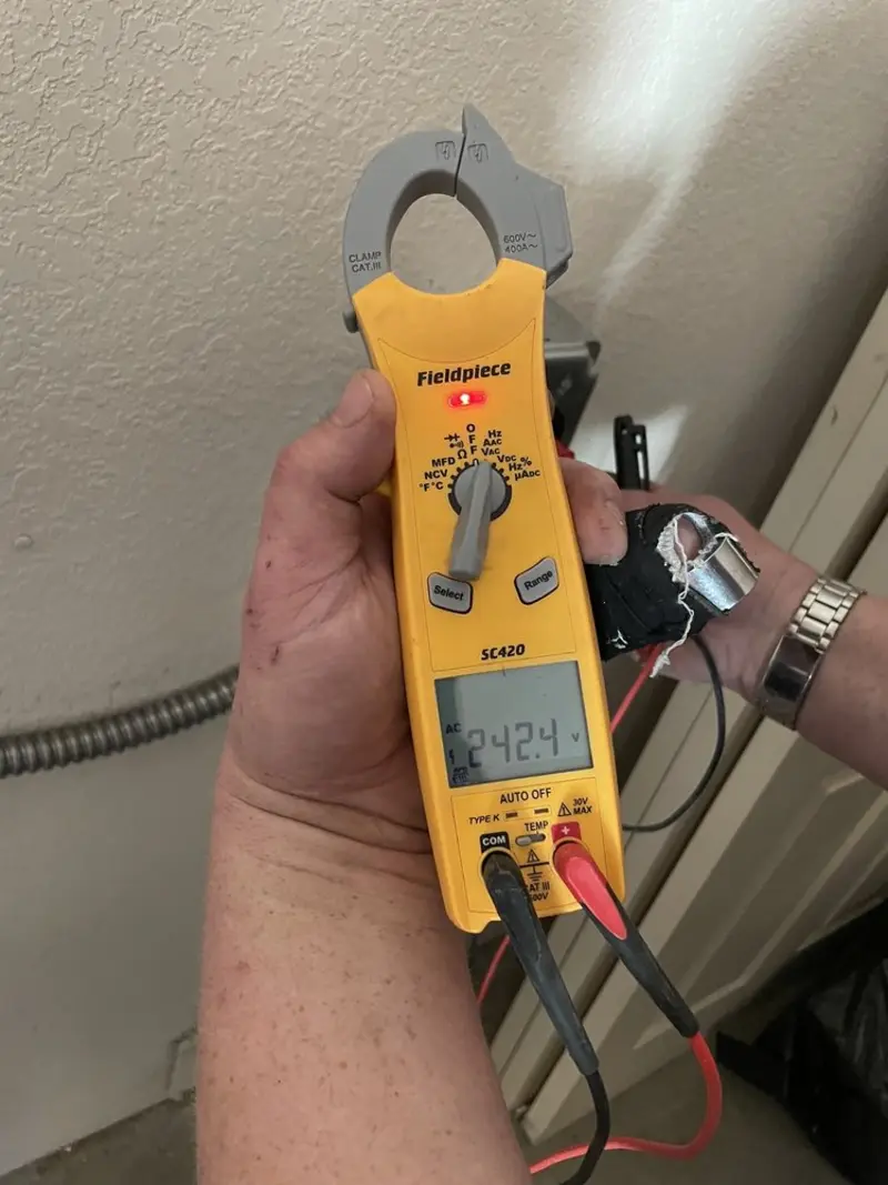 Voltage testing with clamp meter during Electrical Installation Services in Parkwood